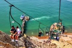 (AB 004) - Alum Bay - I like this slightly more unusual shot, looking straight down from the chair lift, with the pier leading out to sea. I find the composition in this shot pleasing with the triangle shapes created by the chair lift cables against the sea.